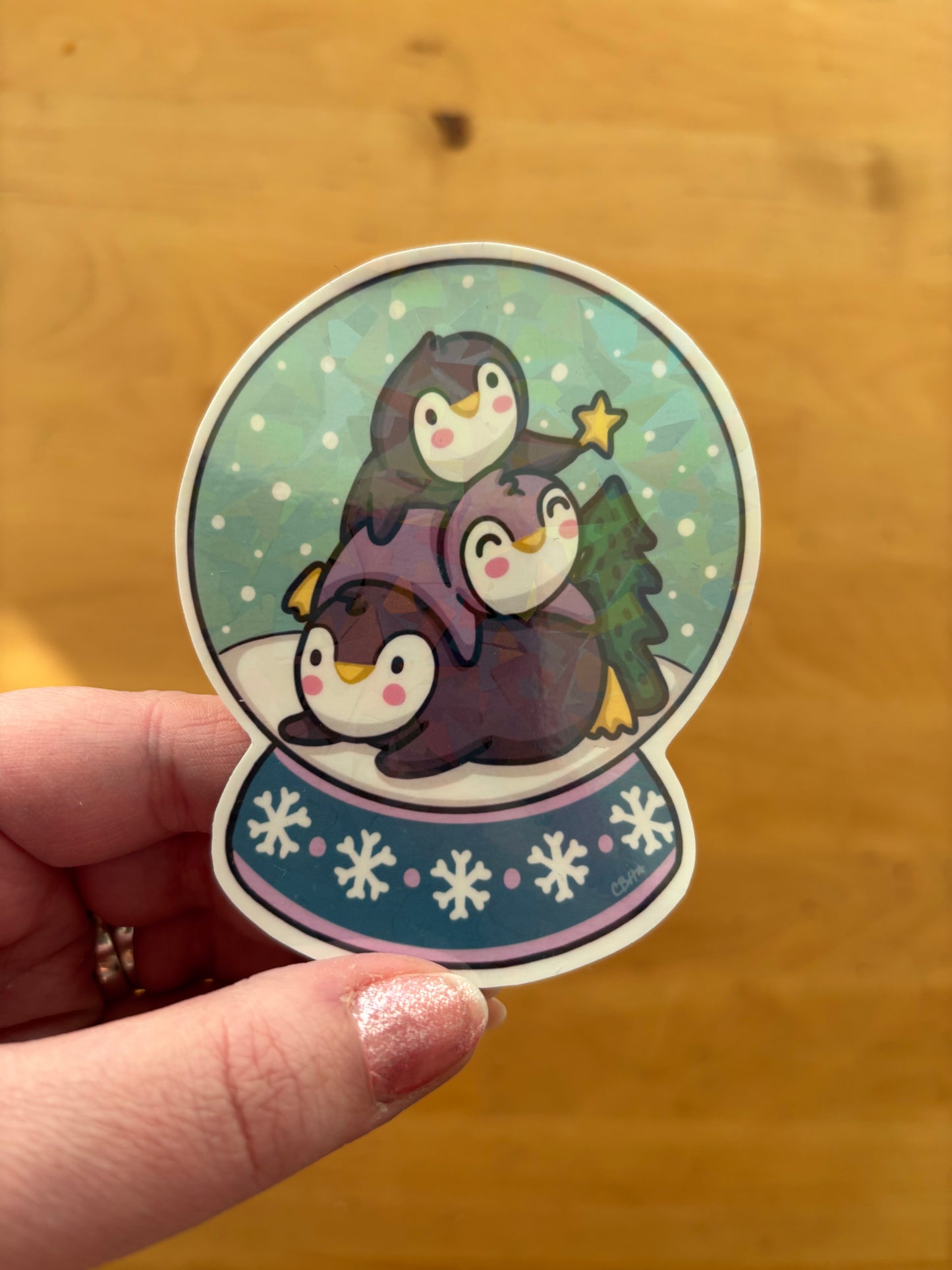 Penguin Pile Snowglobe holographic vinyl sticker (large)