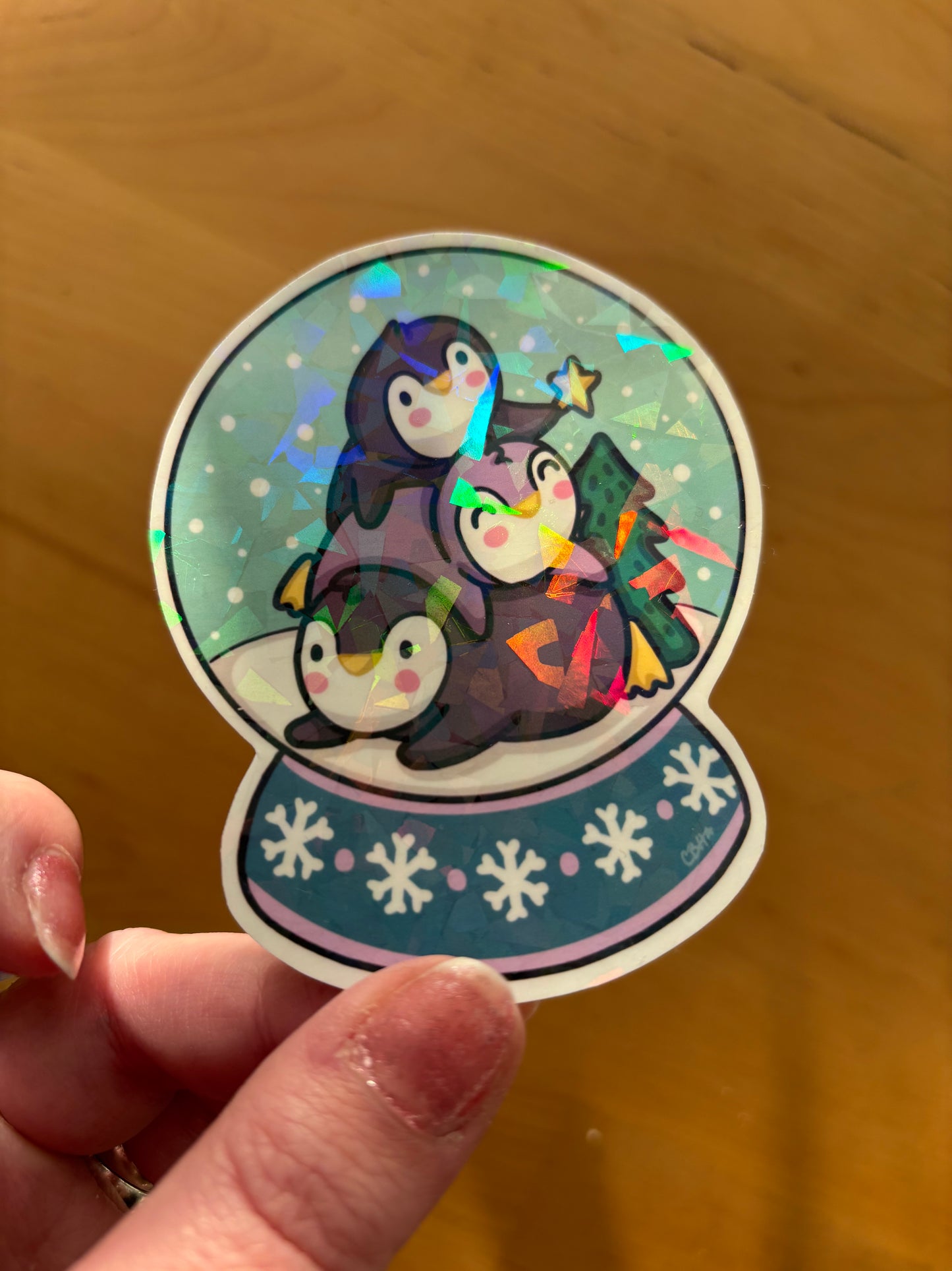 Penguin Pile Snowglobe holographic vinyl sticker (large)