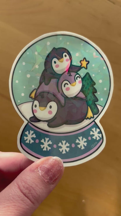 Penguin Pile Snowglobe holographic vinyl sticker (large)